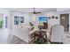 Elegant living room featuring a comfortable sofa, stylish décor, and views of the backyard pool area at 437 South Dr, Punta Gorda, FL 33950