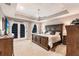 Spacious main bedroom with a tray ceiling, plush carpet, and private access to a balcony at 437 South Dr, Punta Gorda, FL 33950
