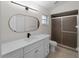 Bathroom showcasing a shower and updated vanity with black fixtures at 464 Rose Apple Cir, Port Charlotte, FL 33954