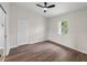 Sunlit bedroom with hard surface floors, closet, and a window providing natural light at 464 Rose Apple Cir, Port Charlotte, FL 33954