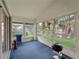 Enclosed porch with chairs, barbecue, and windows with nature view at 464 Rose Apple Cir, Port Charlotte, FL 33954