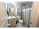 This bathroom includes a shower-tub combo, tile flooring, and updated vanity at 477 Ricold Ter, Port Charlotte, FL 33954