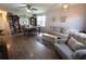 Open-concept living area with hardwood floors, ample seating, and natural light at 477 Ricold Ter, Port Charlotte, FL 33954