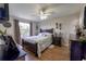 This bedroom has hardwood floors, a ceiling fan, and a double-hung window at 477 Ricold Ter, Port Charlotte, FL 33954