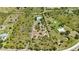 A large parcel of land with a long driveway and a residence; this aerial shot showcases the property's expansive space at 5950 Cypress Grove Cir, Punta Gorda, FL 33982