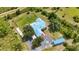 Home with a metal roof, a fire pit, and a large lawn in Prairie Creek Park at 5950 Cypress Grove Cir, Punta Gorda, FL 33982