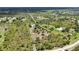 Home with a metal roof and a long driveway in Prairie Creek Park at 5950 Cypress Grove Cir, Punta Gorda, FL 33982