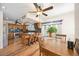 Kitchen featuring wood cabinets, granite countertops, stainless steel appliances and adjacent dining area at 5950 Cypress Grove Cir, Punta Gorda, FL 33982