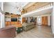 Spacious living room with tall ceilings, a cozy sofa and wood-look laminate flooring at 5950 Cypress Grove Cir, Punta Gorda, FL 33982