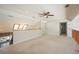 Bright loft area showcasing skylight and ample space, ideal for versatile use at 5950 Cypress Grove Cir, Punta Gorda, FL 33982