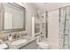 Modern bathroom featuring a shower-tub combo and granite vanity, complete with stylish decorations at 6444 Alhambra Ave, North Port, FL 34291