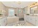 Beautiful bathroom with a modern stand up shower, granite countertop vanity, and bright lighting at 6444 Alhambra Ave, North Port, FL 34291