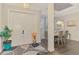 Elegant foyer featuring a double door entry, dark wood floors, and formal dining area at 6444 Alhambra Ave, North Port, FL 34291