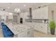 Well-equipped kitchen featuring stainless steel appliances, a center island, and ample counter space at 6444 Alhambra Ave, North Port, FL 34291