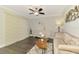 Comfortable living area with wood floors, natural light, and sophisticated decor, perfect for relaxation at 6444 Alhambra Ave, North Port, FL 34291