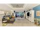 Open living room with modern decor and sliding glass doors to the lanai at 6444 Alhambra Ave, North Port, FL 34291