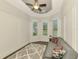 Cozy living room with decorative pillows, a patterned rug, and paneled walls at 6444 Alhambra Ave, North Port, FL 34291