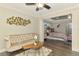 Open concept living room that connects to the main bedroom with a decorative interior design at 6444 Alhambra Ave, North Port, FL 34291