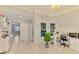 Bright office with a modern desk, decorative plant, and an adjacent sitting area at 6444 Alhambra Ave, North Port, FL 34291