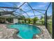 Enjoy the Florida sunshine in the backyard pool, spa, and screened-in enclosure at 6444 Alhambra Ave, North Port, FL 34291