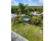 Expansive property showcasing a well-maintained yard, swimming pool, and multiple structures at 1027 Coral Ridge Dr, Punta Gorda, FL 33950