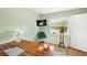This bedroom features a desk, a chair, a window, and a minimalist decorative setup at 1027 Coral Ridge Dr, Punta Gorda, FL 33950