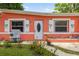 Charming exterior with decorative palm tree shutters and a well-maintained lawn at 1027 Coral Ridge Dr, Punta Gorda, FL 33950