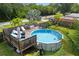 Backyard featuring an above-ground pool and deck, perfect for outdoor entertainment and relaxation at 1027 Coral Ridge Dr, Punta Gorda, FL 33950