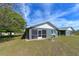 Backyard view showcasing a screened lanai, and spacious yard, offering outdoor enjoyment at 1115 San Cristobal Ave, Punta Gorda, FL 33983