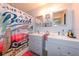 Stylish bathroom with double vanity, beach-themed decor, and modern fixtures at 1115 San Cristobal Ave, Punta Gorda, FL 33983