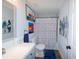 Clean bathroom featuring a modern vanity, toilet, and shower with themed curtain at 1115 San Cristobal Ave, Punta Gorda, FL 33983