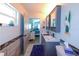 Bathroom with dual vanity, decorative wall tiles and decor, plus convenient access to the bedroom at 1115 San Cristobal Ave, Punta Gorda, FL 33983