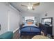 Serene bedroom with blue accents, including a charming bed and complementary decor, offers a tranquil retreat at 1115 San Cristobal Ave, Punta Gorda, FL 33983