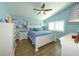 Bright bedroom featuring a vaulted ceiling, wood floors, and white plantation shutters for a modern touch at 1115 San Cristobal Ave, Punta Gorda, FL 33983