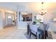 Open-concept dining area flowing into a well-equipped kitchen, creating a harmonious living space at 1115 San Cristobal Ave, Punta Gorda, FL 33983