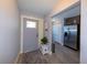 Welcoming entryway with a stylish front door and coat rack near a modern kitchen at 1115 San Cristobal Ave, Punta Gorda, FL 33983