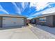 Charming single-story home showcasing a spacious two-car garage and stone walkway at 1115 San Cristobal Ave, Punta Gorda, FL 33983