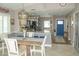 Inviting eat-in kitchen featuring granite countertops, stainless steel appliances, and modern lighting at 1115 San Cristobal Ave, Punta Gorda, FL 33983