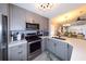 Well-lit kitchen featuring stainless steel appliances and a sleek countertop at 1115 San Cristobal Ave, Punta Gorda, FL 33983