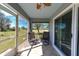 Relaxing screened lanai, ideal for enjoying the outdoors, with seating and serene backyard views at 1115 San Cristobal Ave, Punta Gorda, FL 33983