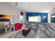 Comfortable living room with a blue accent wall, stylish furnishings, and an entertainment center at 1115 San Cristobal Ave, Punta Gorda, FL 33983