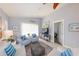 Bright living room showcases coastal decor, tile flooring, and ample natural light, creating an inviting space at 1115 San Cristobal Ave, Punta Gorda, FL 33983