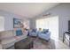 Cozy living room features comfortable seating, colorful rug, and bright light, perfect for relaxing at 1115 San Cristobal Ave, Punta Gorda, FL 33983