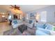 Cozy living room with comfortable seating, a ceiling fan, and a view of the kitchen at 1115 San Cristobal Ave, Punta Gorda, FL 33983