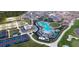 Aerial view of resort-style community amenities including pools, tennis and pickleball courts, and clubhouse at 12390 Wellen Golf St # 202, Venice, FL 34293