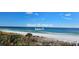 Beautiful beach view with white sand and turquoise water at 12390 Wellen Golf St # 202, Venice, FL 34293