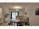 Cozy living room boasts a large sectional sofa, providing ample seating and relaxation, with view to the outside at 12390 Wellen Golf St # 202, Venice, FL 34293