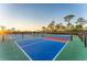 Outdoor pickleball courts at sunset in a beautiful residential community at 12390 Wellen Golf St # 202, Venice, FL 34293
