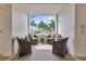 Cozy condo balcony furnished with comfortable wicker chairs, decorative pillows, and a serene outdoor view at 1250 W Marion Ave # 333, Punta Gorda, FL 33950
