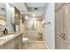 Bathroom featuring a glass-enclosed shower, granite counters and beautiful wood-look cabinetry at 1250 W Marion Ave # 333, Punta Gorda, FL 33950